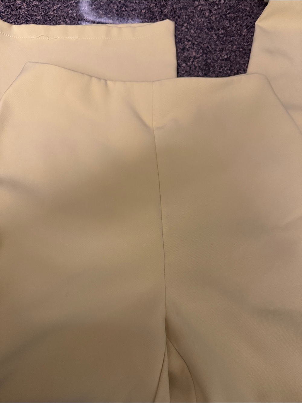 Flat front wide leg yellow trousers.